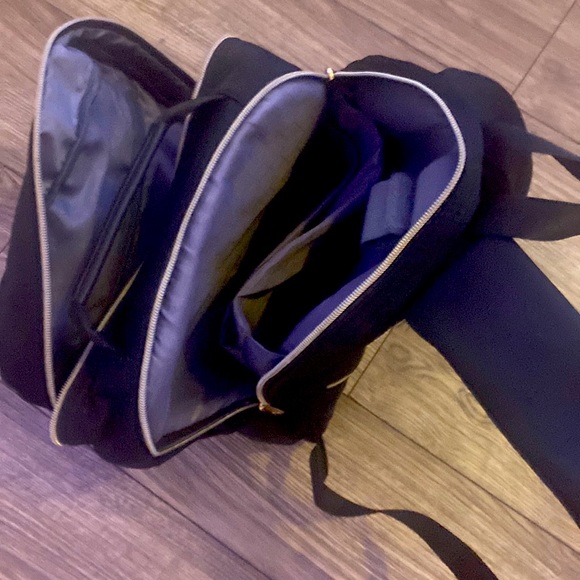 Selling black backpack for school very spacious multiple pockets.